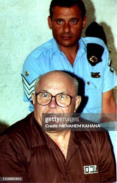 Convicted Nazi war criminal John Demjanjuk hears Israel's Supreme Court in Jerusalem 29 July 1993 read his acquittal more than five years after he...