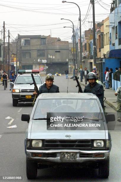 Police patrol the streets of Lima, Peru, 14 August 2001. A transportation strike accompanied by a blockade has partially suspended activity in the...