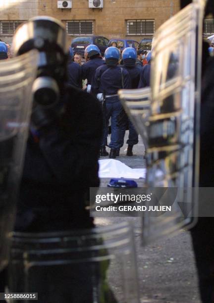 Police surrounds the body of an anti-globalisation activist, Carlo Giuliani, after his death following clashes with police during a rally against the...