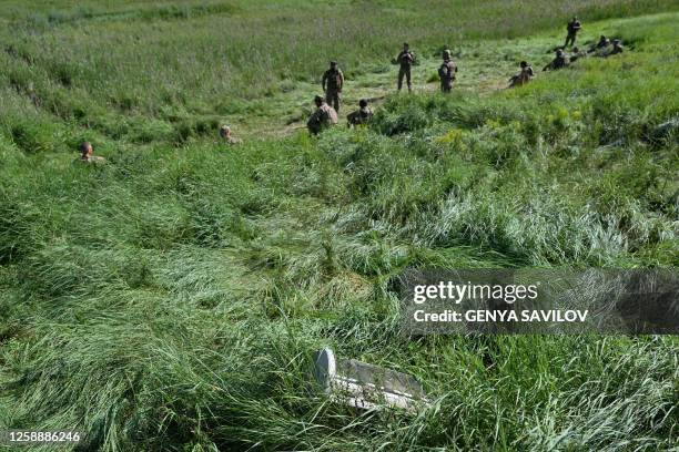 Ukrainian servicemen of the 42th battalion of the 57th Brigade take part in a drill not far from front line in Donetsk region on June 20 amid the...