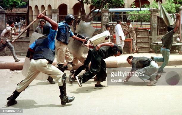 Police use batons on activists of the country's main opposition party, Bangladesh Nationalist Party 02 April 2001 during the second day of a...
