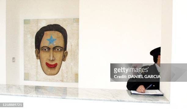 Security guard in front of the acrilic painting titled "The Great Jack," by the argintinian painter Daniel Garcia, 21 September 2001 in the Museum of...