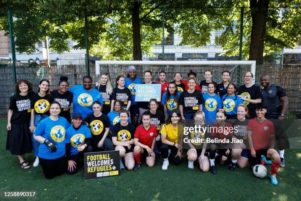 Kim Leadbeater , MP for Batler and Spen in Yorkshire poses with players during the football game on June 21, 2023 in London, England. For Refugee...