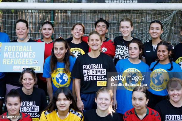 Kim Leadbeater , MP for Batler and Spen in Yorkshire poses with players during the football game on June 21, 2023 in London, England. For Refugee...