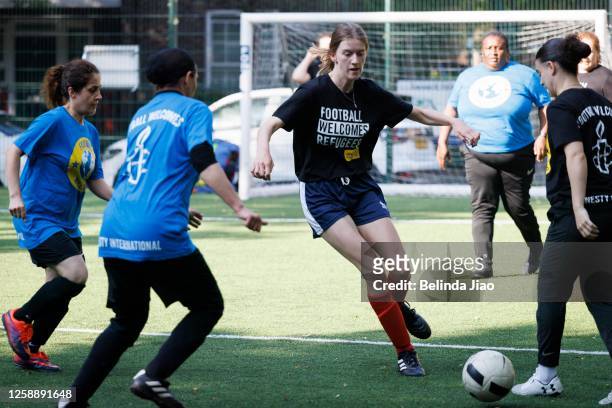 For Refugee week the Afghan National Development Squad - Girl Power and Comfort Angels play against the cross-party UK Women's Parliamentary Football...