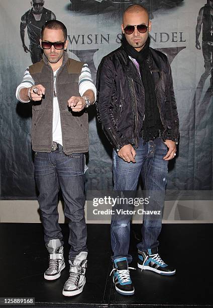 Llandel Veguilla and Juan Luis Morera of Wisin Y Yandel attend a photocall to promote their new album "Los Vaqueros El Regreso Deluxe Edition" at...