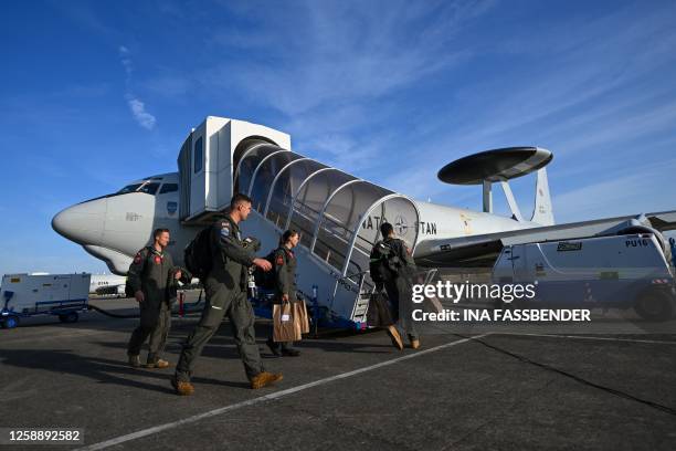 The crew boards a NATO Airborne Warning and Control System aircraft, which participates in the German-led multinational exercise Air Defender 23,...