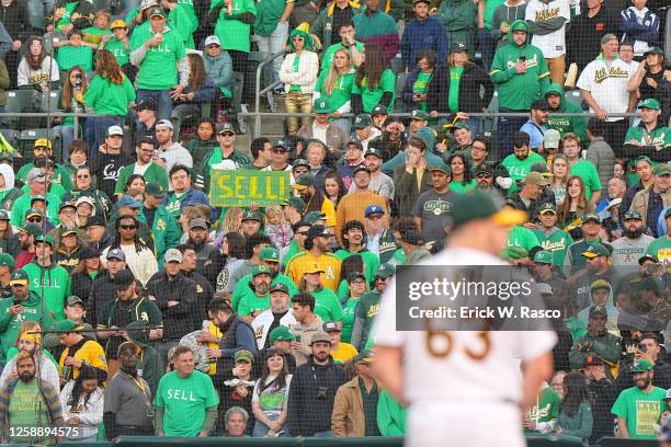 Oakland Athletics fans hold a sign that reads "sell" vs Tampa Bay Rays during a reverse boycott at the Oakland Coliseum. Oakland, CA 6/13/2023...