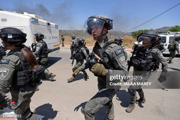 Israeli security forces deploy amid clashes with members of the Druze community during a protest in their village of Masada in the Israel-annexed...