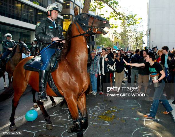 Mounted police officers attempt to break up demonstrators who had targeted the Sydney offices of Australasian Correctional Management in Sydney, 01...