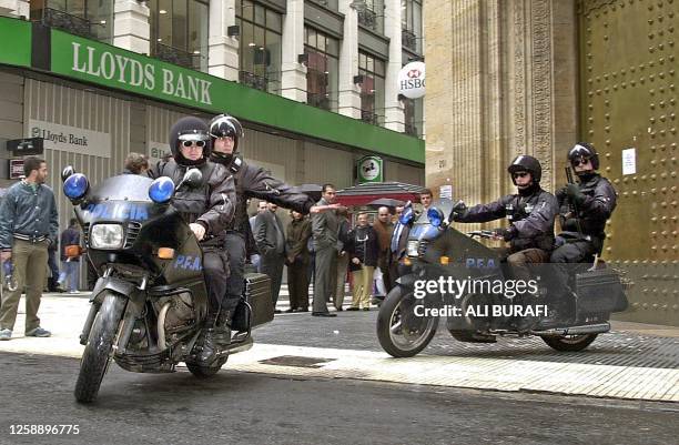 Police secure the area in Buenos Aires, Argentina 22 April 2002. Integrantes de un cuerpo especial de la policia motorizada patrullan el 22 de abril...