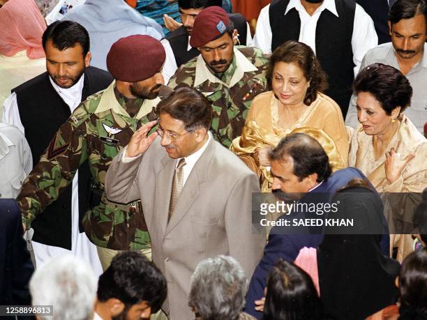 Pakistani President General Pervez Musharraf and his wife Sabah Pervez surrounded by security leave after addressing the women national convention in...