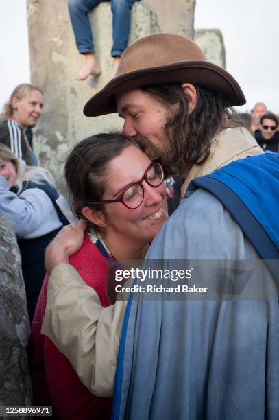 As spiritually-minded revellers celebrate the summer Solstice at the ancient late-Neolithic stones of Stonehenge, a man proposes to his partner, on...