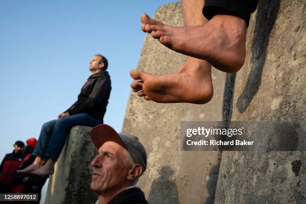 Spiritually-minded revellers celebrate the summer Solstice on the stones at the ancient late-Neolithic stones of Stonehenge, on 21st June 2023, in...