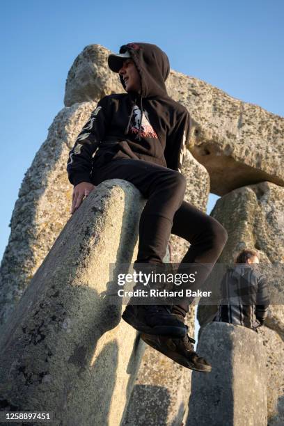 Spiritually-minded revellers celebrate the summer Solstice on the stones at the ancient late-Neolithic stones of Stonehenge, on 21st June 2023, in...