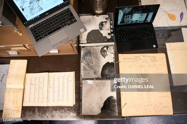 Photograph taken on June 19, 2023 shows archives including pictures and documents from prior Antarctic missions, displayed during a visit of the...