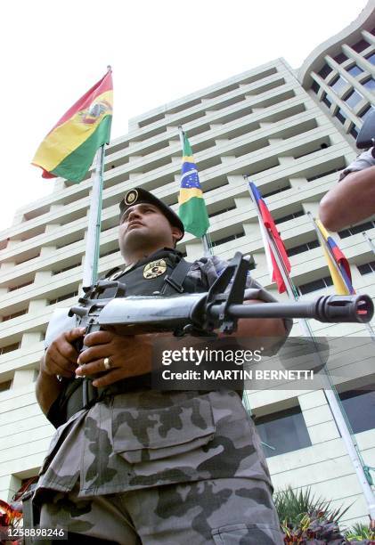 Special service police patrols the entrance of a hotel where the II Meeting of South American Presidents will be held in Guayaquil, 24 July 2002. AFP...