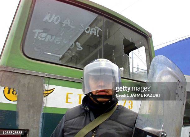 Police patrols a public transportation center in Lima, 17 July 2002, where a 24 hour strike is carried out in protest to a mandatory accident...