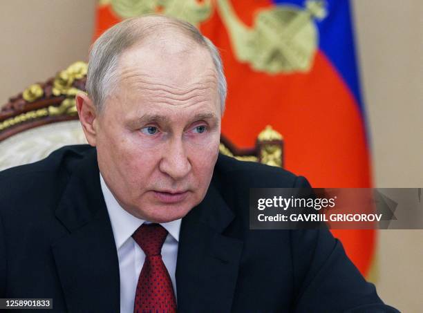 Russia's President Vladimir Putin chairs a meeting with members of the government, via a video conference at the Kremlin in Moscow on June 21, 2023.