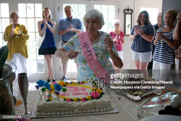 Rose Molkestad dances after blowing out the candles on her birthday cake as she celebrated her 100th birthday at a party at one of her son's house,...