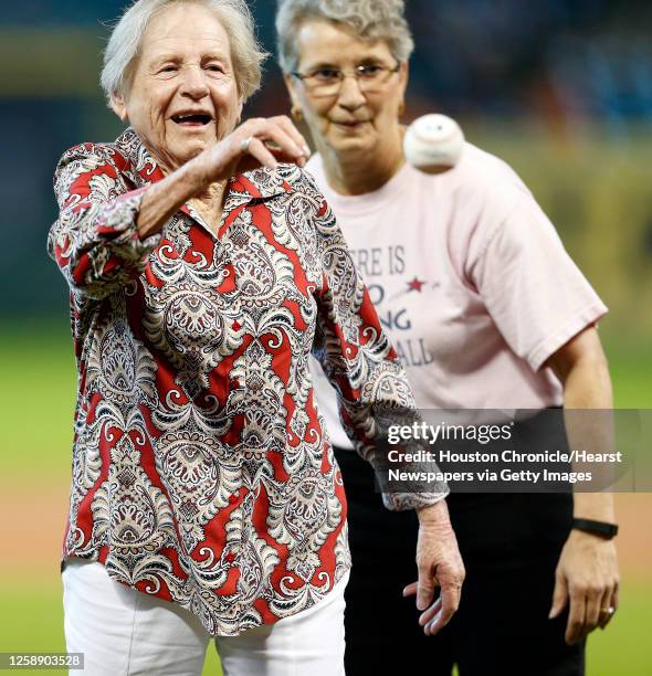 Marie "Red" Mahoney formerly with the All-American Girls Professional throws out the first pitch before the start of an MLB baseball game at Minute...