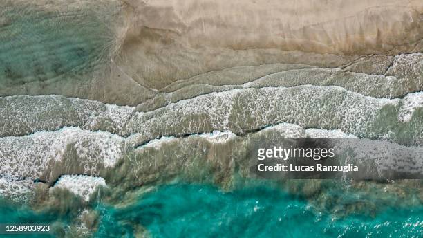 waves and turquoise sea - drone view - arabian sea stock pictures, royalty-free photos & images