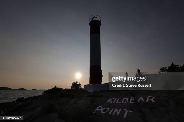 Campers capture sunsets as smoke from wild fires in Northern Ontario and Quebec cause sun halos as the sunsets at Lighthouse Point at Killbear...