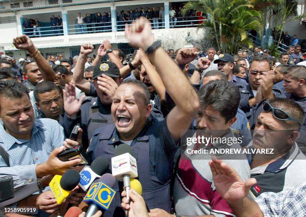 Metropolitan police officer speaks to the press in Caracas, 08 October 2002. A motorized brigade of the MP tried to take over the command of the...