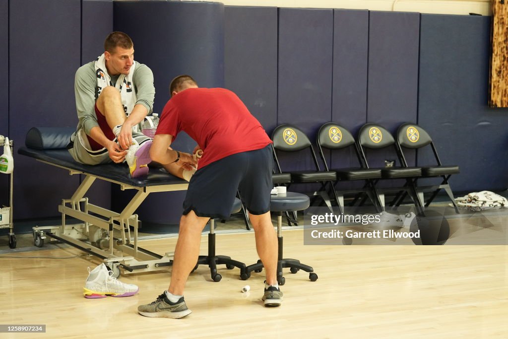 Nikola Jokic of the Denver Nuggets gets treatment during 2023 NBA ...
