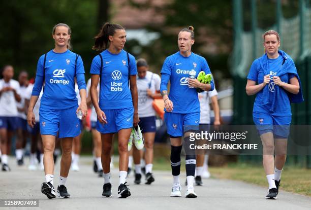 France's goalkeepers Mylene Chavas, Constance Picaud, Pauline Peyraud-Magnin and Solene Durand arrive for a training session in...