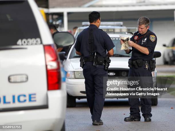 Investigators with the Houston Police department prepare a mould that they would later place in a tire track at the scene where a woman in her 20s,...