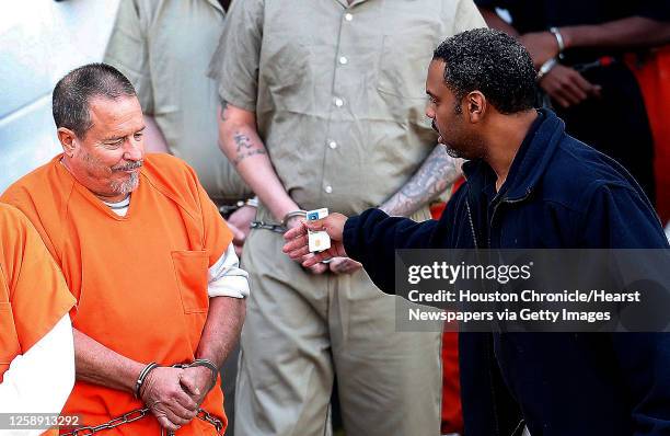 Jeff Pike, national president of the Bandidos Motorcycle Club, is lead out of the Federal Courthouse, after he was freed by a federal magistrate...