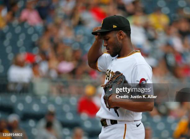 Roansy Contreras of the Pittsburgh Pirates reacts after giving up a home run in the seventh inning against the Chicago Cubs at PNC Park on June 21,...