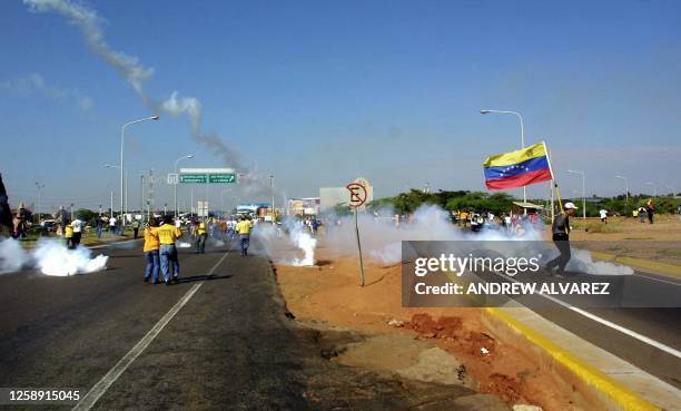 Demonstration in opposition to President Hugo Chavez, is disperesed by the police using tear gas at the entrance of a bridge in Lake Maracaibo,...