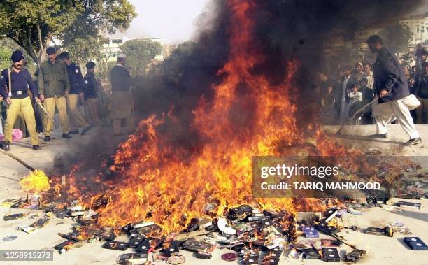 Pakistani police burn obscene movie cassettes and CDs as part of a religious parties alliance Muttahida Majlis-e-Amal government aggressive campaign...