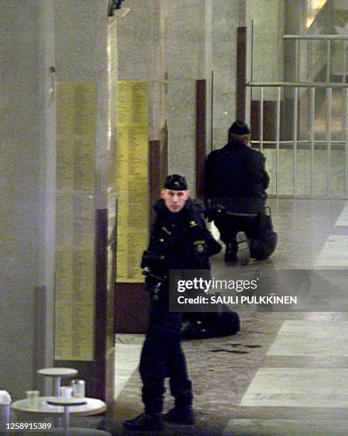 Police take position inside the Central Railway Station in Stockholm, where a Russian-speaking male robbery suspect was reportedly holding a female...