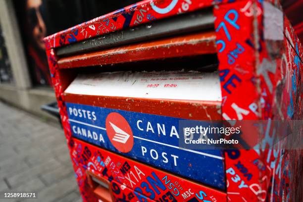 Canada Post logo is seen on a mail box in Montreal, Canada on June 13, 2023.