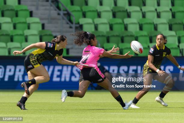 Southern Headliners player Magali Harvey passes the ball as her jersey is pulled from behind during the Women's semi-finals match between Pittsburgh...