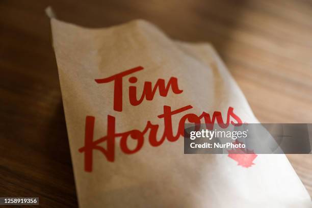 Tim Hortons logo is seen on a bag in this illustration photo taken at a restaurant in Montreal, Canada on June 15, 2023.