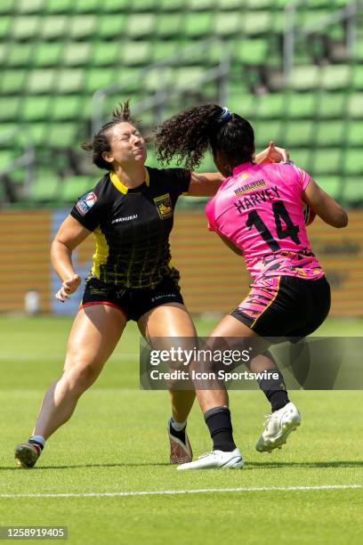 Southern Headliners player Magali Harvey runs through a tackle attempt by Pittsburgh Steeltoes player Camile White during the Women's semi-finals...