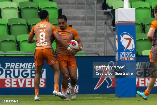 Texas Team player Line Latu and Texas Team player Jermoe Nale celebrate after scoring a try during the Men's semi-finals match between Texas Team and...