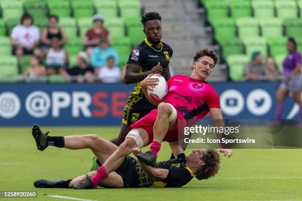 New York Locals player Hugh Johnston is brought down from behind by Pittsburgh Steeltoes player Mickey Bateman during the Men's semi-finals match...