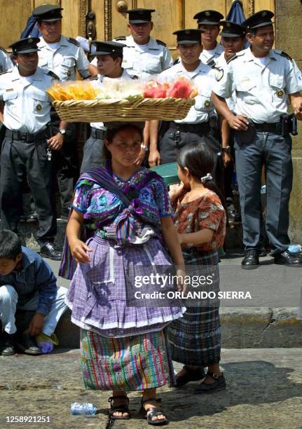 Police officers secure the entrance of the National Congress in Guatemala City as students and teachers continue to strike demanding an increase in...