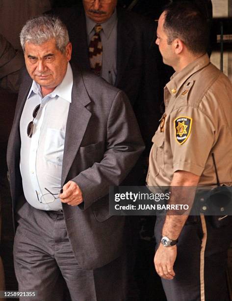 Carlos Ortega , leader of the Venezuelan Workers Confederation , leaves the Costa Rican Embassy 27 March, 2003 in Caracas followed by Costa Rican...