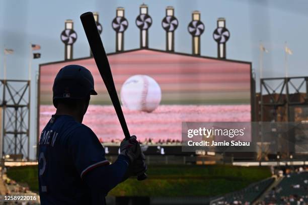 Marcus Semien of the Texas Rangers warms up before batting against the Chicago White Sox in the first inning at Guaranteed Rate Field on June 21,...