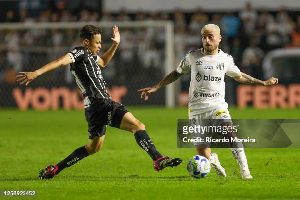 Matheus Araujo of Corinthians fights for the ball with Lucas Lima of Santos during the match between Santos and Corinthians as part of Brasileirao...