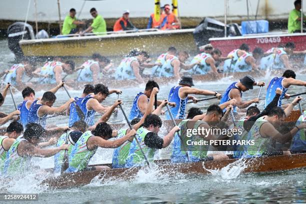 Competitors take part in dragon boat races held to celebrate the Tuen Ng festival in the Aberdeen typhoon shelter in Hong Kong on June 22, 2023.