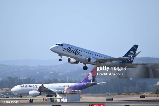 Alaska and Hawaiian Airlines planes takeoff at the same time from San Francisco International Airport in San Francisco, California, United States on...