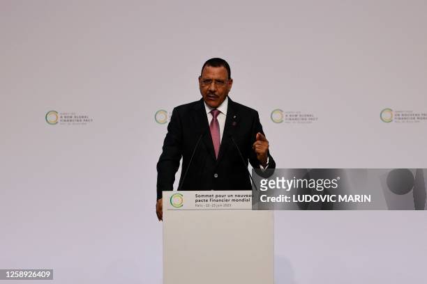President of Niger, Mohamed Bazoum delivers a speech during the opening session of the New Global Financial Pact Summit at the Palais Brongniart in...