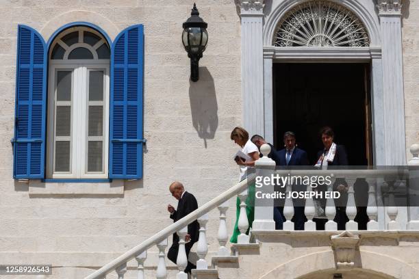 France's new special envoy for Lebanon Jean-Yves Le Drian descends a stair after meeting with Lebanon's Christian Maronite Patriarch, at the Maronite...